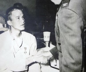Ronnie, age 19, shaking the hand of a colonel in a military hospital in 1970